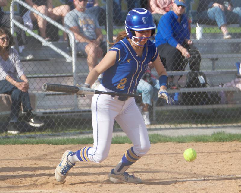 Wheaton North's Alyssa Savenok lays down a bunt against Oswego on Tuesday May 6, 2025 in Wheaton.